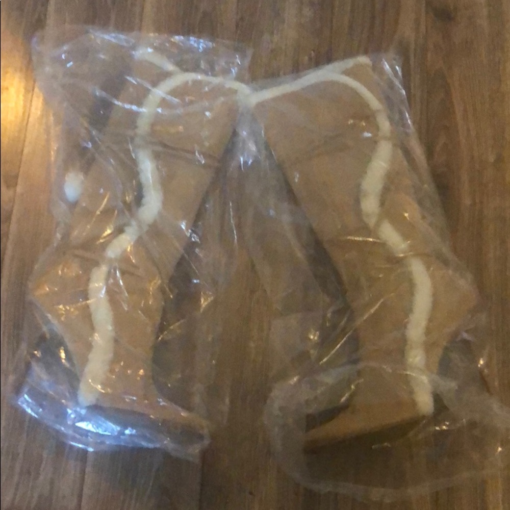 Tan furry boots w/ balls